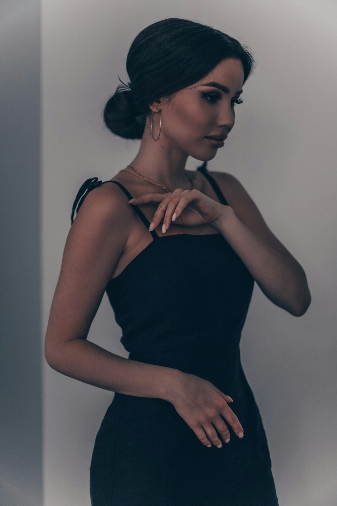elegant woman trying on jewelry