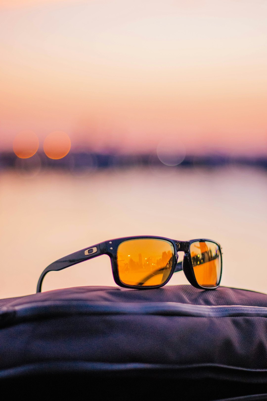 Luxury sunglasses with golden light reflection