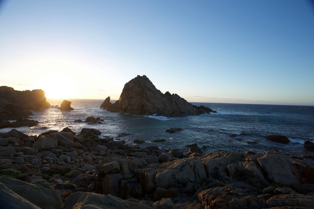 Sunset over La Mano de Punta del Este with golden light